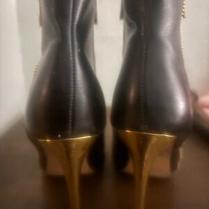 Elegant Black and Gold Heeled Boots
